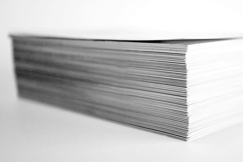 stack of folded company marketing brochures  